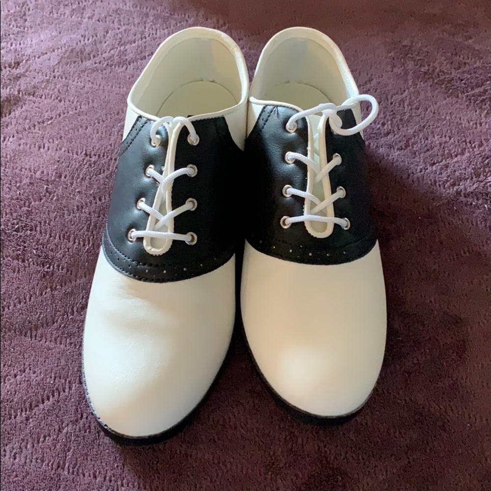 Black and white saddle shoes.